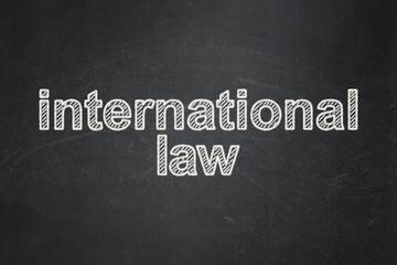 Obraz premium Political concept: International Law on chalkboard background