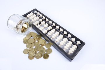 Abacus and coins. Business concept