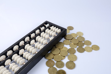Abacus and coins. Business concept