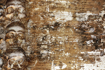 Grunge Halloween background with human skulls