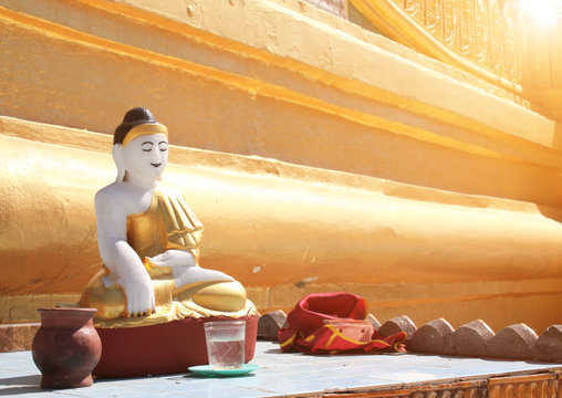 Old stone statue of meditating Buddha, Bago, Myanmar