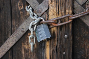 Old wooden doors chained with padlock