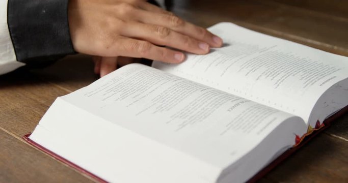 Mid-section of blind woman reading a braille book 4k