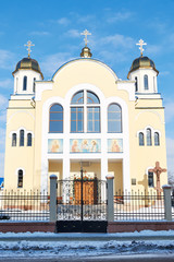 Fototapeta premium Church of the apostles Peter and Paul,Zhovkva,Lviv oblast a clear winter day