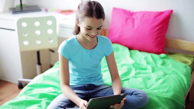 girl with tablet pc having video chat at home