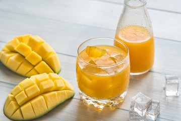 Mango juice on the wooden table