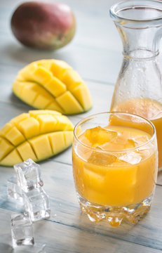 Mango juice on the wooden table