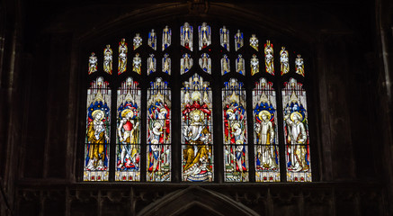 Fototapeta na wymiar Church of St John the Baptist Stained Glass G Cirencester England