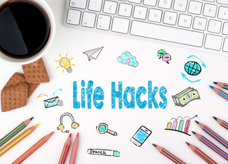 Life Hacks. Computer keyboard and a coffee mug on a white table