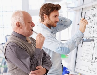 Young and senior architects working together