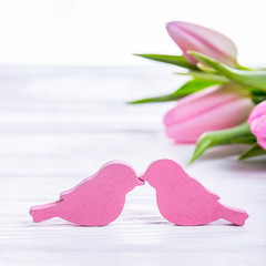 Happy Valentine's Day. Two pink birds kissing