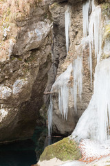 Fototapeta na wymiar Waterfalls and ice water games - Winter in wild Friuli
