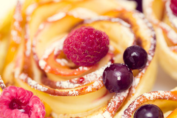 apple muffin with raspberries and blueberries