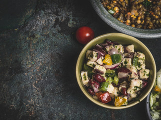 Healthy vegetarian red Beans salad with feta in bowl on rustic background, top view, close up, border. Diet eating, Vegetarian food concept