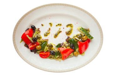 delicious greek salad on  plate on white background