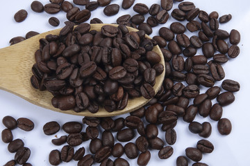 roasted coffee beans isolated on white background close up.