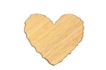 Burned heart shape white paper on wooden table