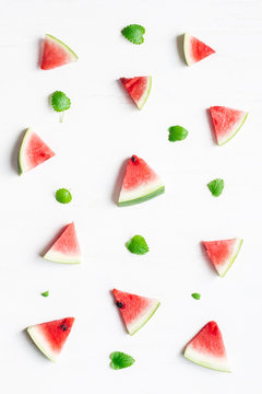 Pattern made of watermelon slices on white background. Top view, flat lay