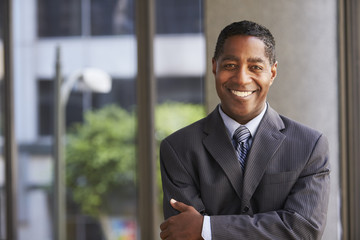 Middle aged black businessman looking at camera