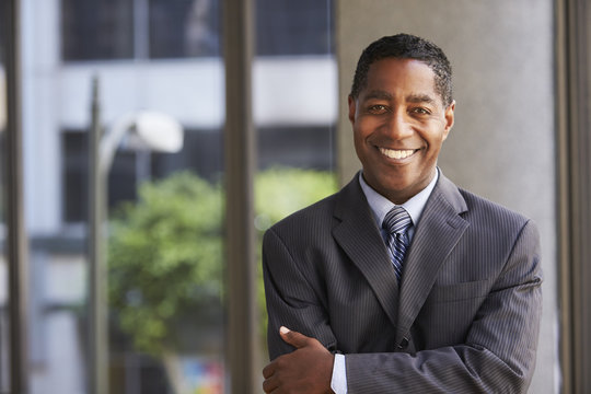 Middle Aged Black Businessman Looking At Camera