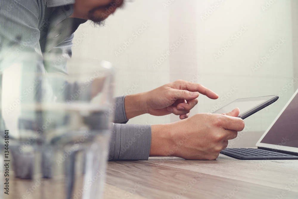 Poster website designer working digital tablet and computer laptop with