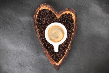 Coffee beans in a heart shaped bowl