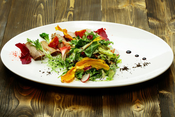 Green salad with baked meat