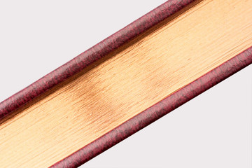gilded edge of the book on a gray background close-up on a diagonal
