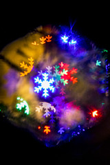 colorful holiday textured Christmas background with snow flakes