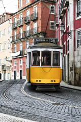 Fototapeta na wymiar Old tram in the streets of Lisbon