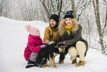 Fototapeta na wymiar family fun is photographed with a dog