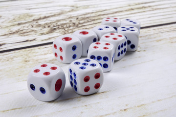 White dice on wooden background.  Concept of luck, chance and leisure fun.