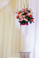 Beautiful fresh floral centerpiece bouquet at wedding reception