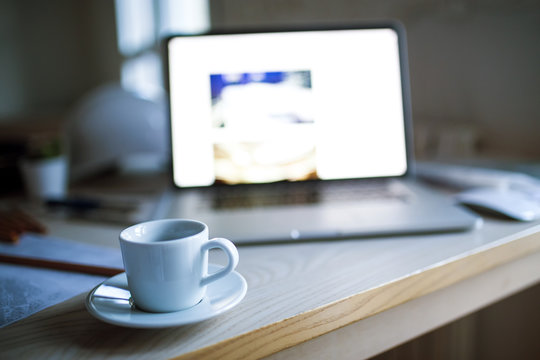 Laptop and coffee mug