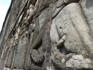 Fototapeta na wymiar 石のレリーフ　遺跡　カンボジア　彫刻　芸術　壁画　仏像