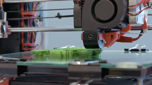 Automatic three dimensional 3d printer performs product creation. Modern 3D printing or additive manufacturing and robotic automation technology.