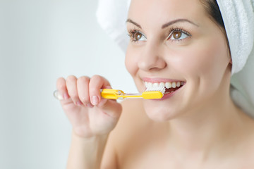Woman brushing her teeth 