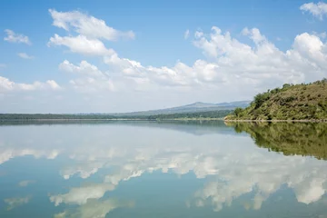 Foto op Plexiglas Blue sky reflected in waters of Elmenteita Lake, Kenya © eunikas