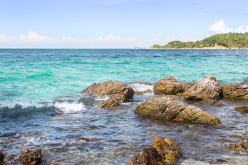 Rocky coast blue sea with wave and bright sky 2.