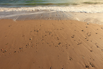 Patterns of sand and waves on the beach in the Black Sea