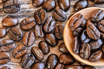 Coffee beans on wood background