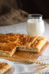 Backed pie and glass of milk