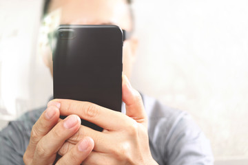 Designer hand using mobile payments online shopping,omni channel