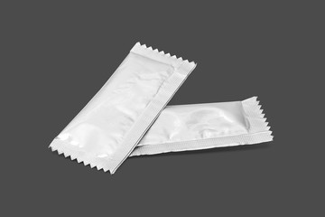 blank packaging sugar foil sachet isolated on gray background