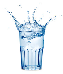 Splashing in the glass of water isolated on white background