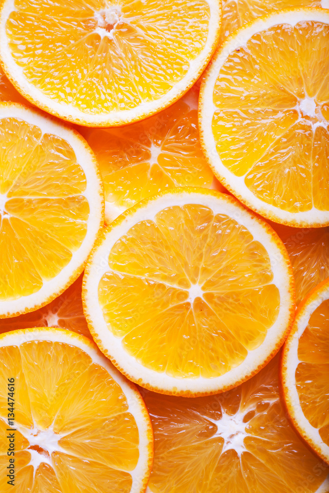 Wall mural close up of orange slices background