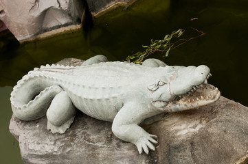 stone sculpture alligator