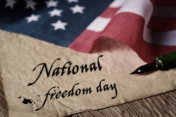 Fototapeta na wymiar text national freedom day and american flag