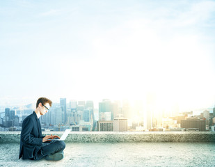 businessman sitting with laptop