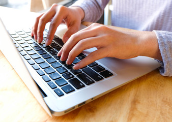 Woman office worker is typing keyboard